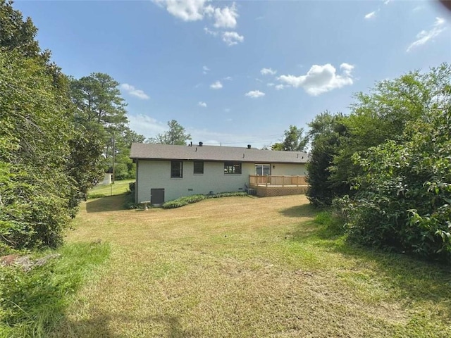 rear view of house with a lawn