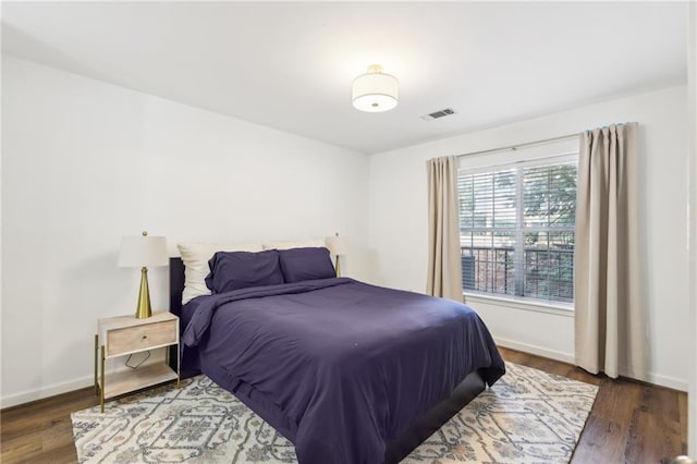 bedroom featuring dark hardwood / wood-style floors