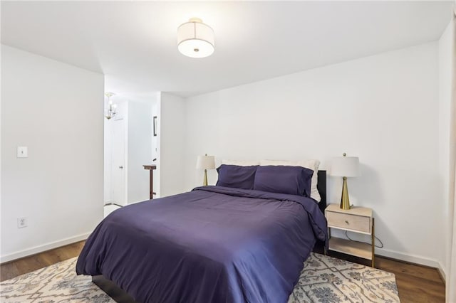 bedroom featuring dark hardwood / wood-style flooring