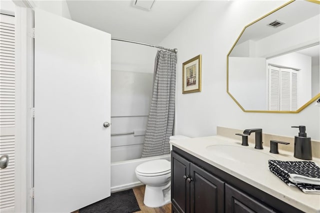 full bathroom with vanity, hardwood / wood-style floors, shower / tub combo with curtain, and toilet