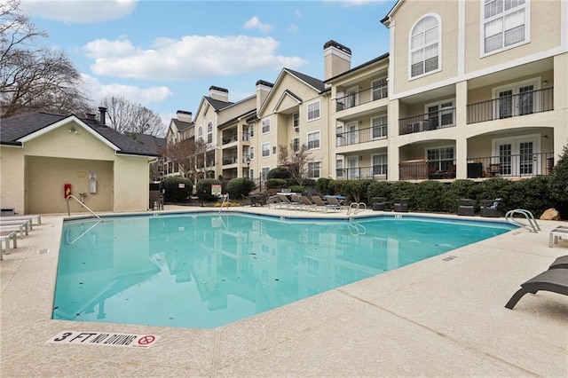 view of swimming pool featuring a patio area