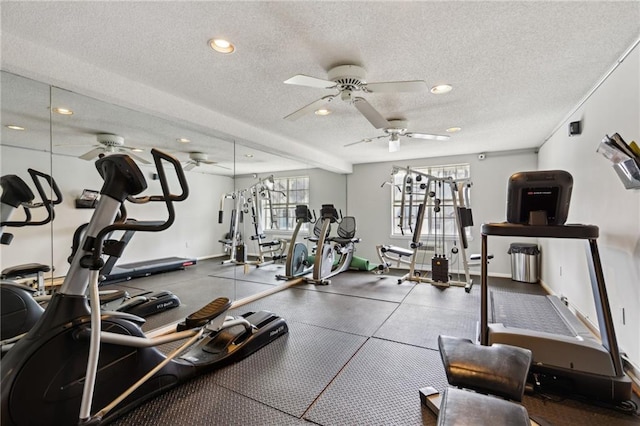 exercise room featuring ceiling fan and a textured ceiling