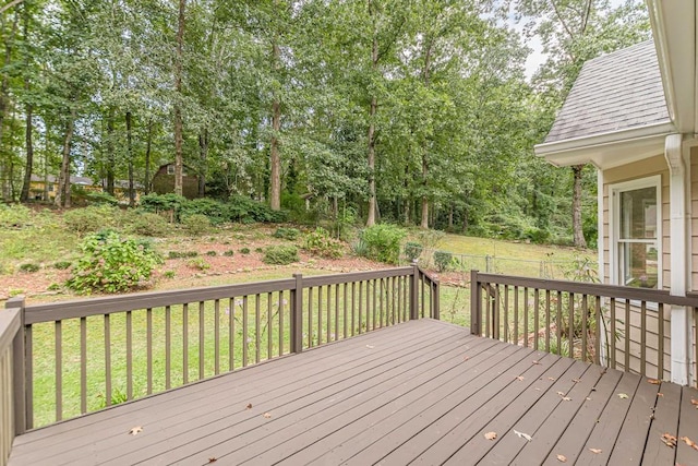 wooden terrace with a lawn