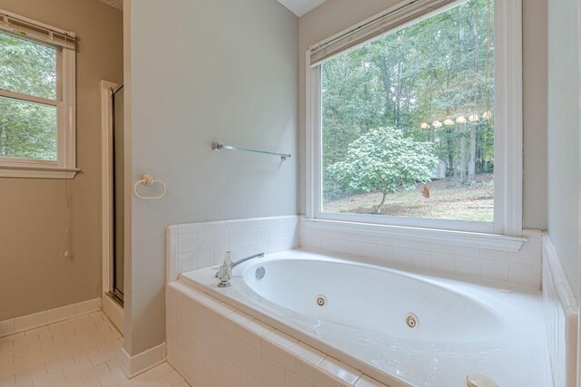 bathroom featuring independent shower and bath and tile patterned floors