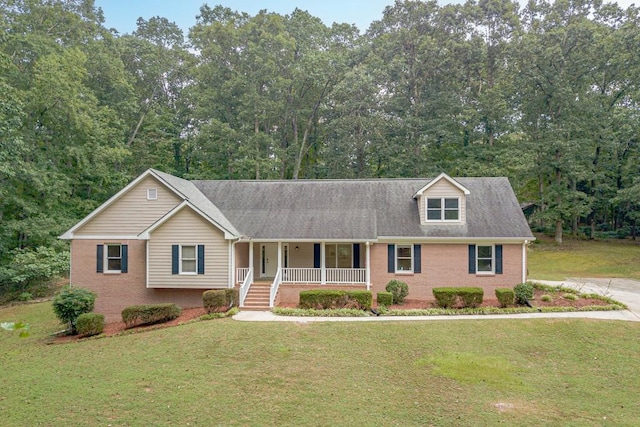 view of front of house with a front yard and a porch