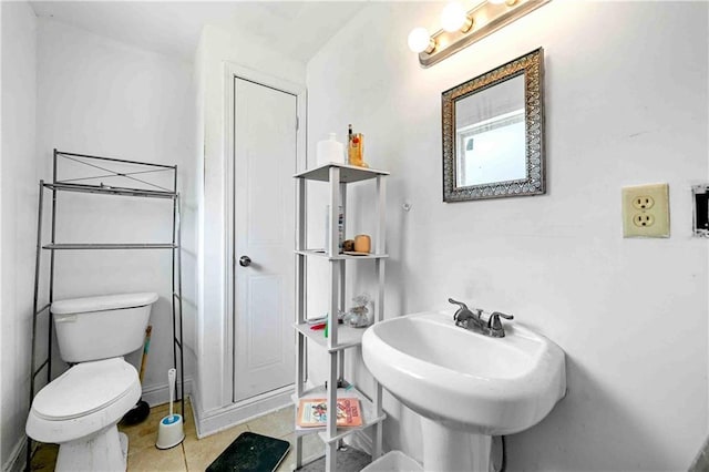bathroom featuring tile patterned floors and toilet