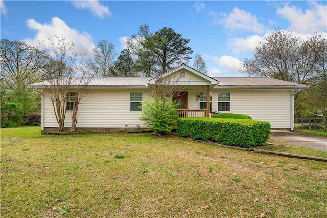 single story home with metal roof, a front lawn, and a porch