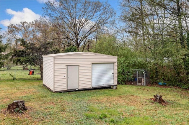 view of shed featuring fence