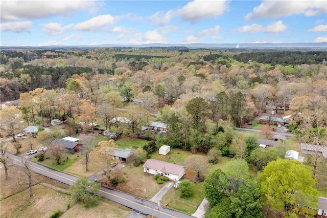 drone / aerial view featuring a view of trees