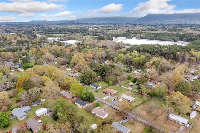 birds eye view of property with a mountain view