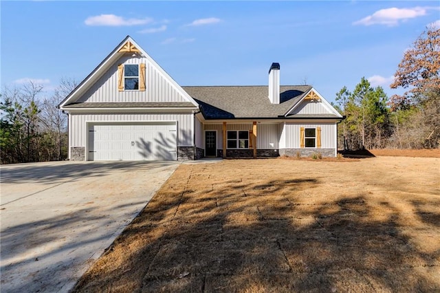 modern inspired farmhouse featuring a garage