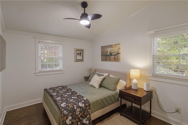 bedroom featuring baseboards, vaulted ceiling, wood finished floors, and ornamental molding