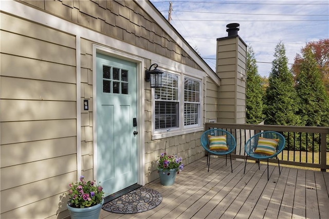 doorway to property featuring a wooden deck