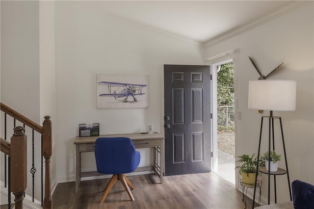 office space featuring ornamental molding, wood finished floors, and baseboards