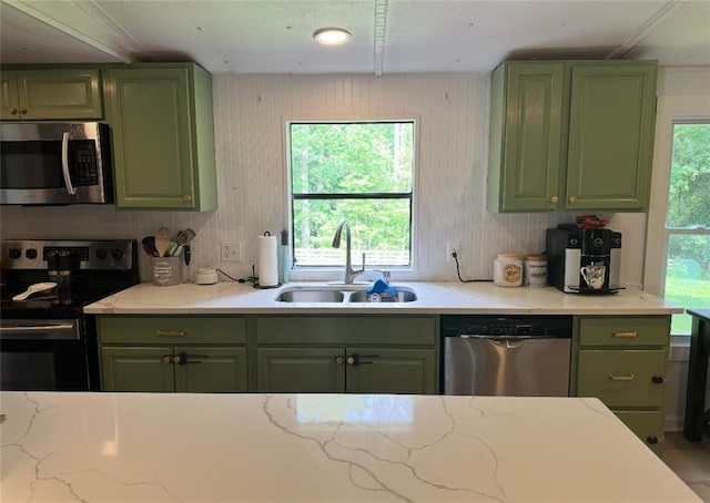 241 Wooten Ct, Canton, GA 30114 - kitchen with green cabinets, appliances with stainless steel finishes, and light stone counters