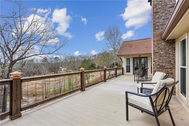 wooden deck featuring french doors