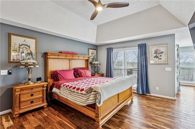 bedroom with multiple windows, lofted ceiling, baseboards, and wood-type flooring