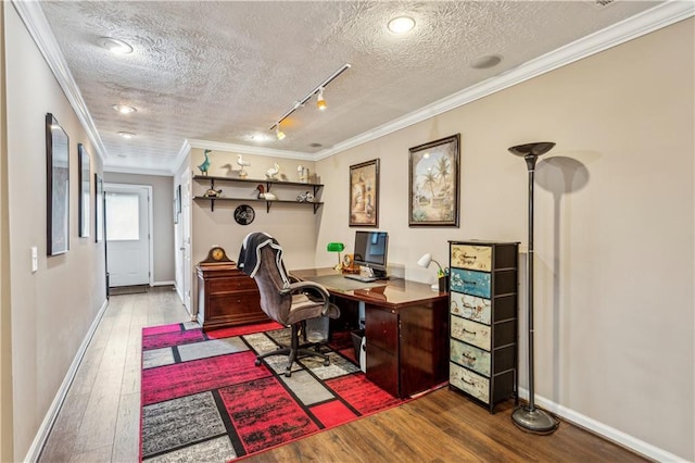 office with baseboards, ornamental molding, rail lighting, a textured ceiling, and wood-type flooring