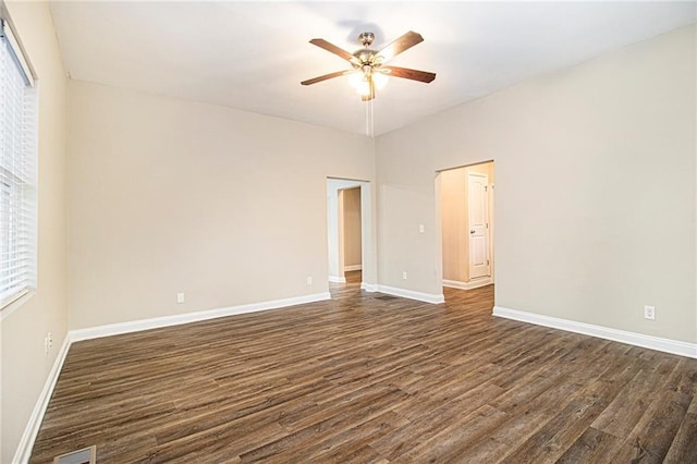 unfurnished room featuring dark wood-type flooring and ceiling fan