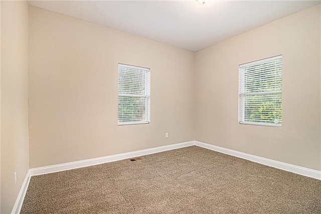 spare room with carpet flooring