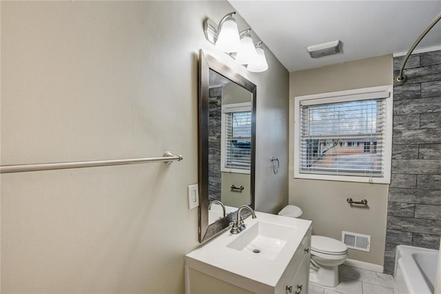 full bathroom featuring vanity, bathing tub / shower combination, and toilet