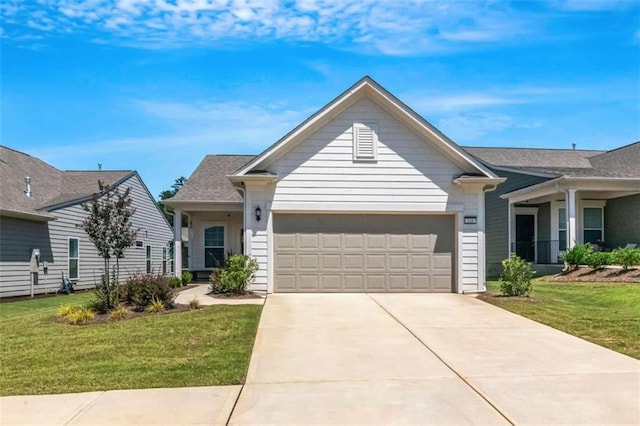 view of front facade with a garage and a front lawn