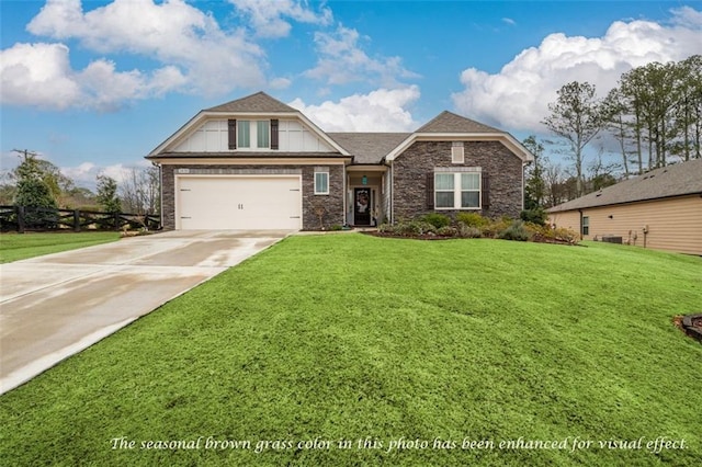 view of front of house with a front yard and a garage