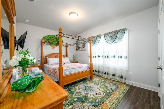 bedroom featuring dark hardwood / wood-style floors