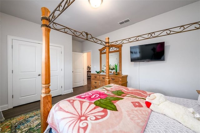 bedroom featuring dark wood-type flooring