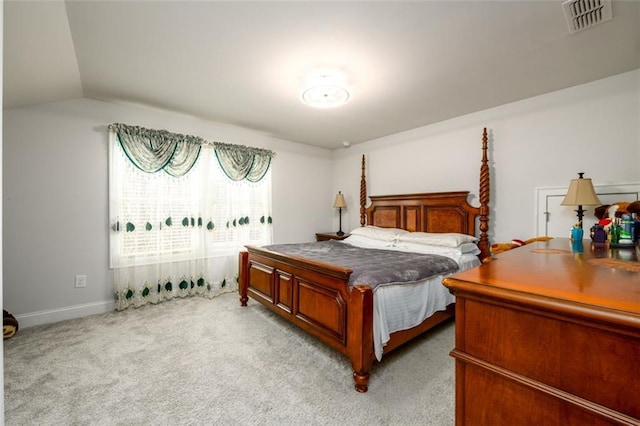 carpeted bedroom featuring vaulted ceiling