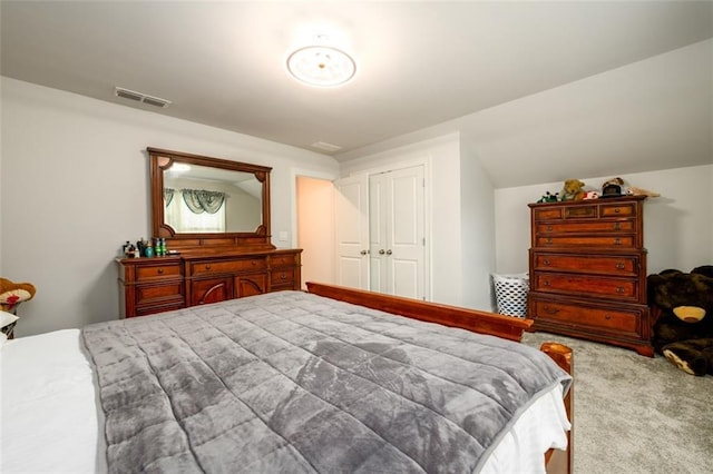 bedroom with light carpet and a closet