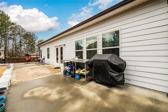 view of property exterior with a patio area