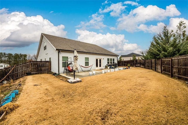 rear view of property featuring a patio area