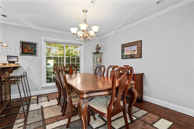 dining room featuring ornamental molding, a notable chandelier, and dark hardwood / wood-style floors