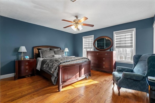 bedroom featuring light wood-type flooring and ceiling fan