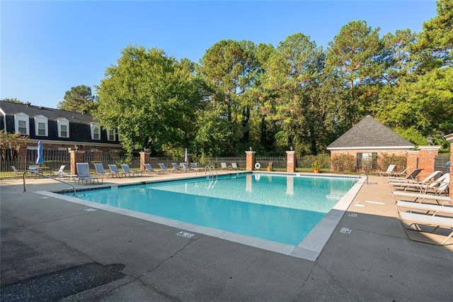 view of swimming pool featuring a patio area