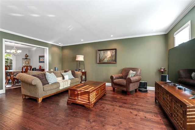 living room featuring ornamental molding, dark wood-type flooring, and a chandelier