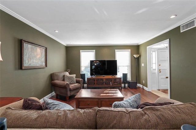 living room featuring crown molding and light hardwood / wood-style floors