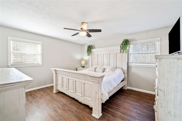 bedroom with ceiling fan and dark hardwood / wood-style floors