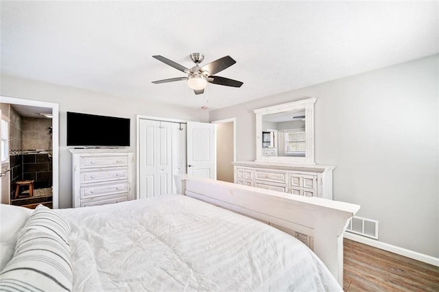 bedroom featuring hardwood / wood-style flooring, a closet, and ceiling fan