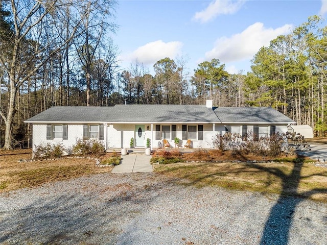 single story home with covered porch