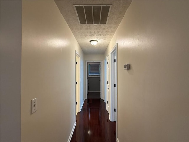 1245 Mulberry Mill Ln, Lawrenceville, GA 30043 - hall featuring a textured ceiling and dark wood-type flooring