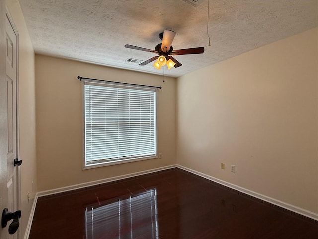 1245 Mulberry Mill Ln, Lawrenceville, GA 30043 - empty room featuring a textured ceiling, a ceiling fan, and dark wood-style flooring