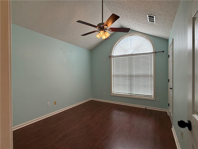 1245 Mulberry Mill Ln, Lawrenceville, GA 30043 - empty room featuring a textured ceiling, a ceiling fan, dark wood-type flooring, and vaulted ceiling