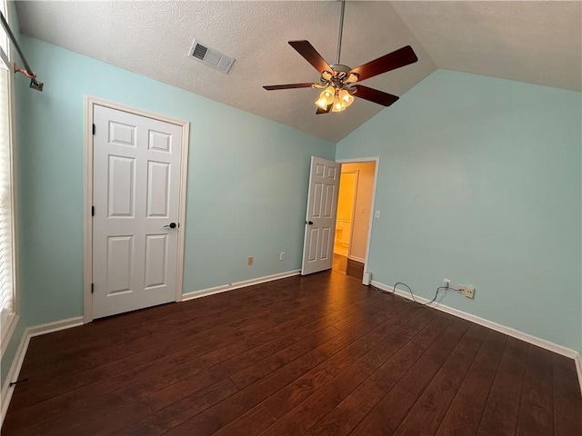 1245 Mulberry Mill Ln, Lawrenceville, GA 30043 - unfurnished bedroom featuring dark wood-type flooring, lofted ceiling, and a ceiling fan
