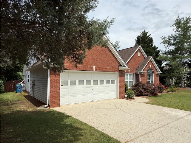 1245 Mulberry Mill Ln, Lawrenceville, GA 30043 - view of front of property with brick siding, a front yard, concrete driveway, and a garage