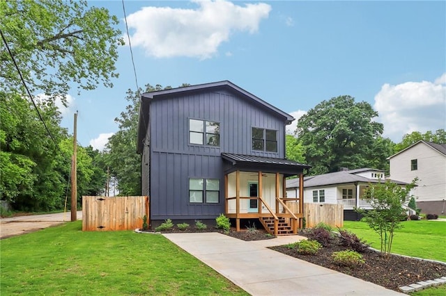 1129 Victory Dr SW, Atlanta, GA 30310 - modern farmhouse style home with a porch, a standing seam roof, board and batten siding, metal roof, and a gate