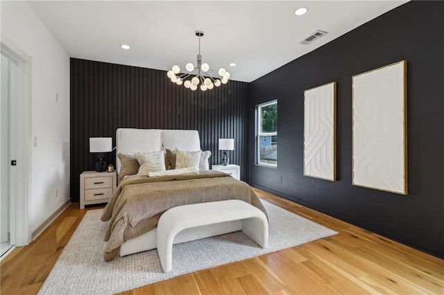 1129 Victory Dr SW, Atlanta, GA 30310 - bedroom with an accent wall, a chandelier, recessed lighting, wood finished floors, and baseboards