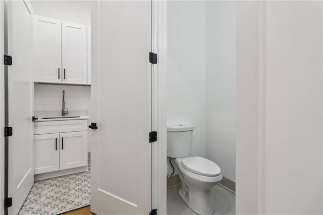 1129 Victory Dr SW, Atlanta, GA 30310 - bathroom featuring toilet, vanity, and baseboards