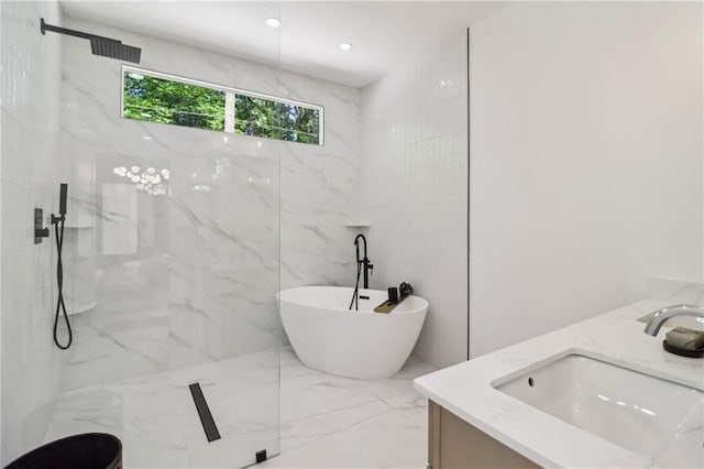 1129 Victory Dr SW, Atlanta, GA 30310 - bathroom featuring double vanity, marble tiled flooring, a freestanding tub, a marble finish shower, and tile walls